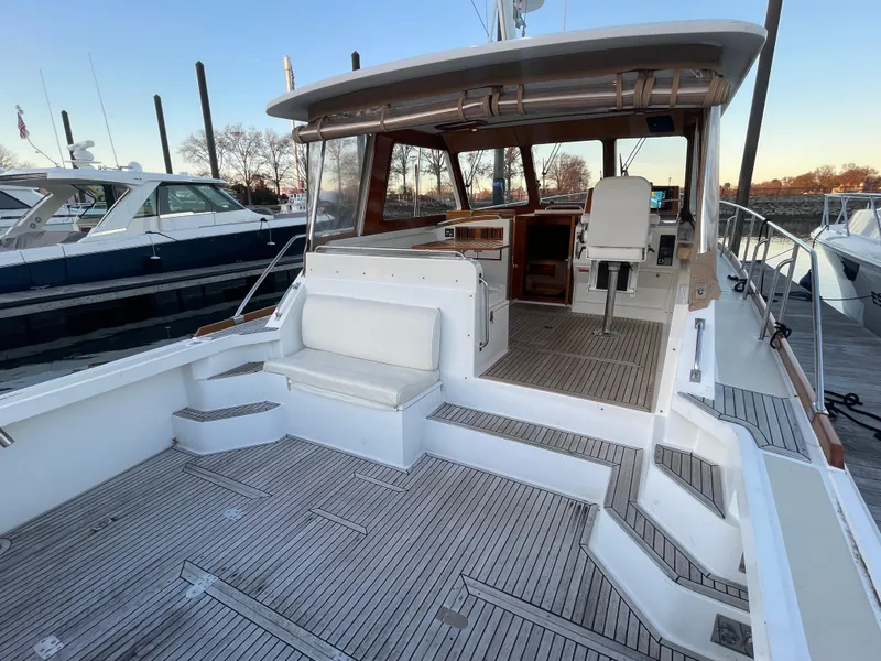 Slide: The Image of 2001 Grand Banks Eastbay 38 HX yacht with spacious deck and elegant interior. - 20