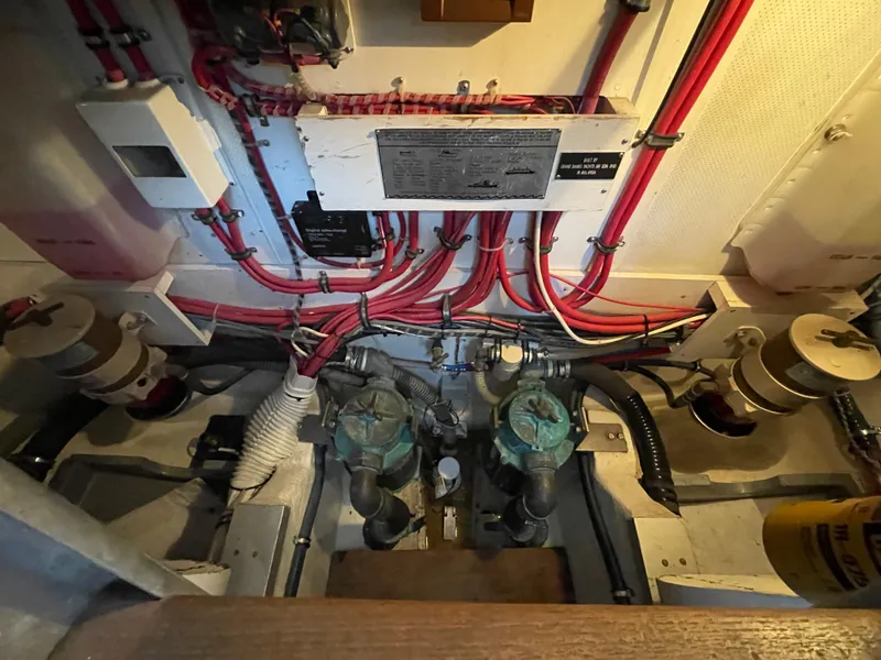 Slide: The Image of Engine room of 2001 Grand Banks Eastbay 38 HX with wiring and mechanical components. - 44