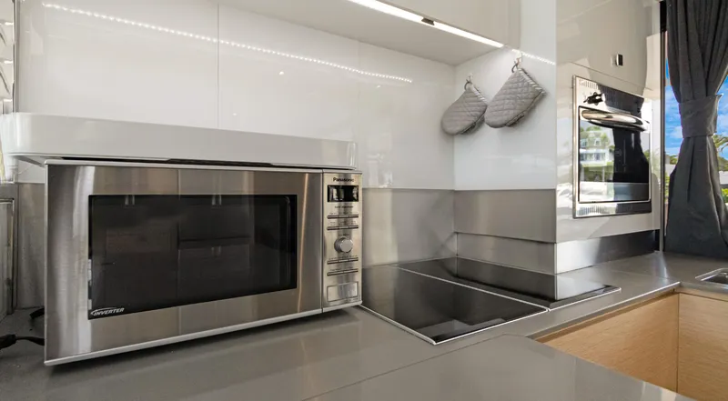 Slide: The Image of Modern kitchen in 2018 Fountaine Pajot MY 44 yacht with microwave and stovetop. - 15