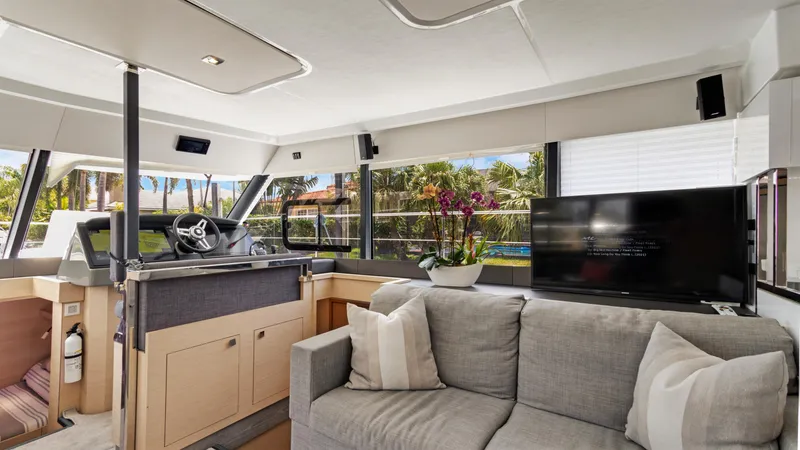 Slide: The Image of Luxurious interior of 2018 Fountaine Pajot MY 44 yacht with modern decor and large windows. - 18