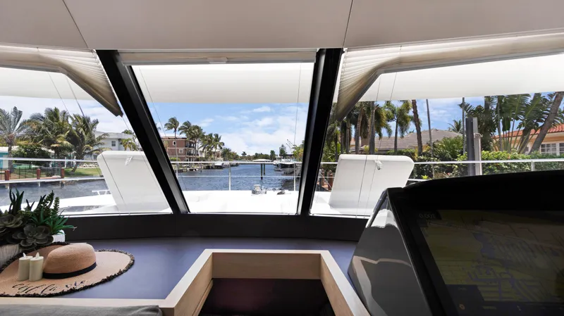 Slide: The Image of Interior view from 2018 Fountaine Pajot MY 44 yacht, showcasing scenic waterfront. - 25
