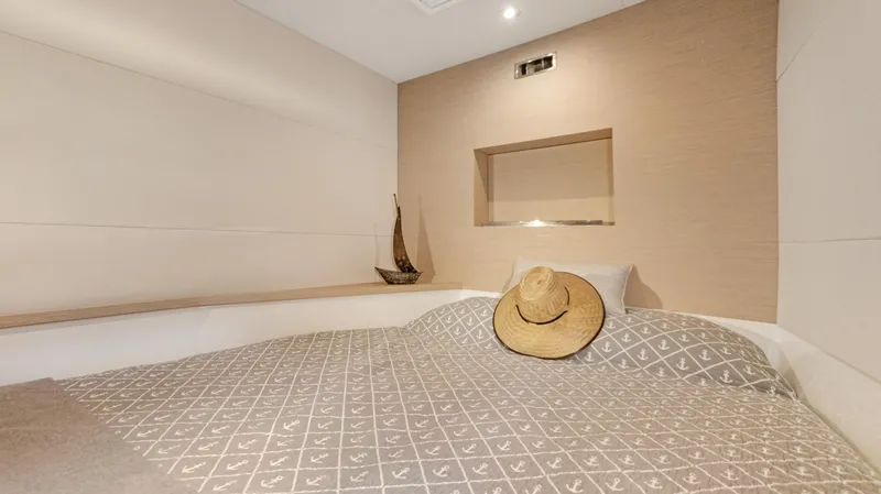 Slide: The Image of Cozy bedroom in 2018 Fountaine Pajot MY 44 yacht with decorative hat and model ship. - 26