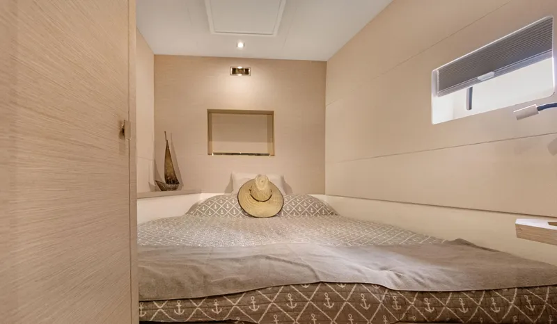 Slide: The Image of Cozy bedroom in 2018 Fountaine Pajot MY 44 yacht with elegant decor and natural light. - 38