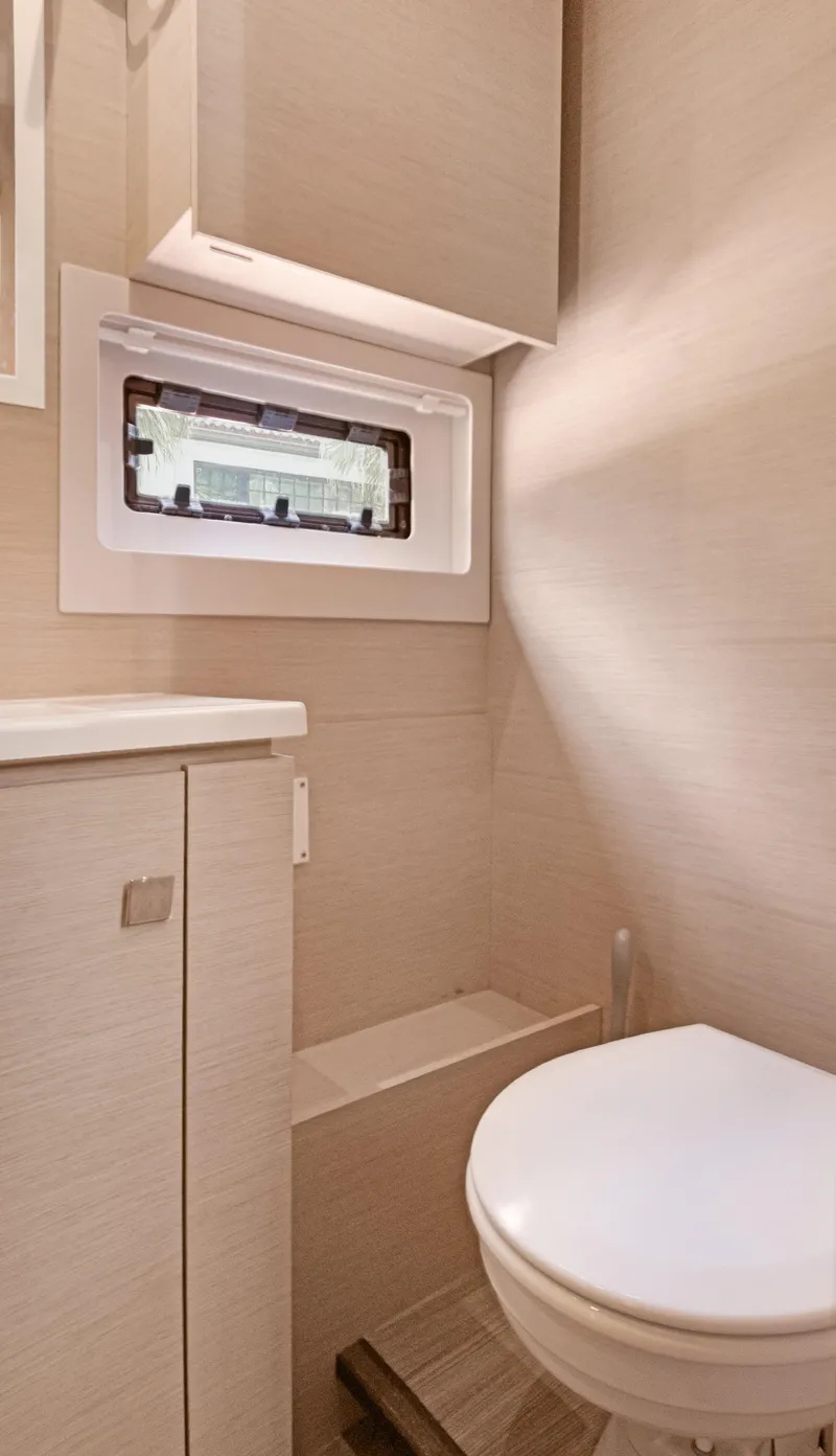 Slide: The Image of 2018 Fountaine Pajot MY 44 yacht bathroom with compact design and window. - 39