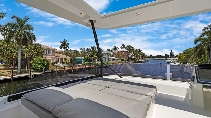 Slide: The Image of Fountaine Pajot MY 44 yacht, 2018 model, with luxurious deck view of waterfront homes. - 46