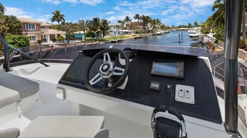 Slide: The Image of Fountaine Pajot MY 44 yacht helm, 2018 model, with waterfront view. - 48