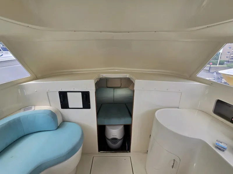 Slide: The Image of Interior of 1961 Bertram 31 Flybridge Cruiser with seating and compact cabin space. - 14