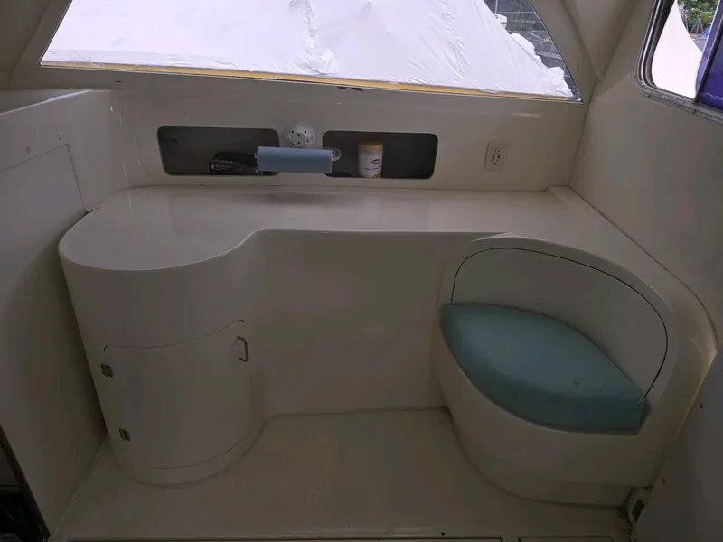 Slide: The Image of Interior of a 1961 Bertram 31 Flybridge Cruiser with seating and storage. - 17