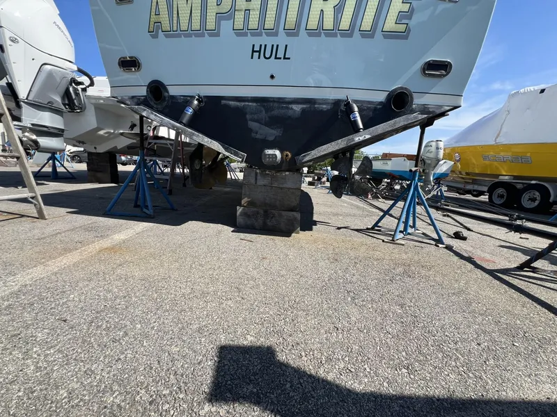 Slide: The Image of 1961 Bertram 31 Flybridge Cruiser on stands, rear view, with "Amphitrite" name visible. - 18