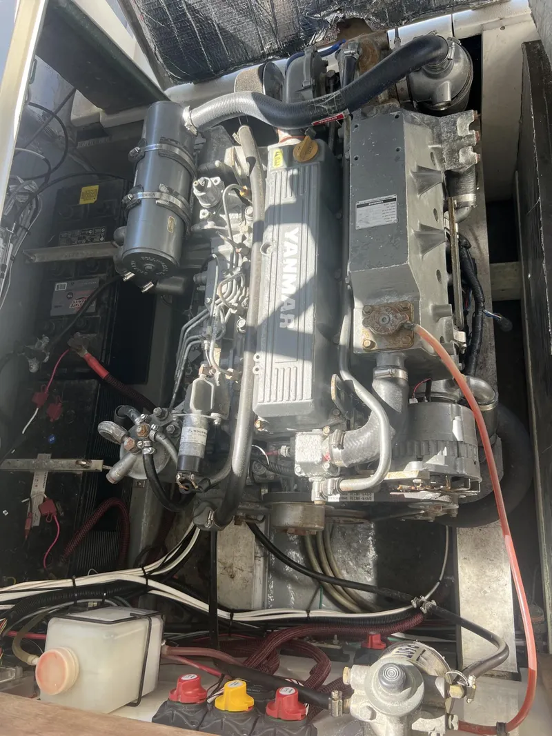 Slide: The Image of Engine compartment of a 1961 Bertram 31 Flybridge Cruiser, showcasing mechanical components. - 19