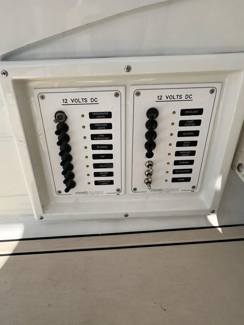 Slide: The Image of Electrical panel on 1961 Bertram 31 Flybridge Cruiser, featuring 12 volts DC switches. - 21