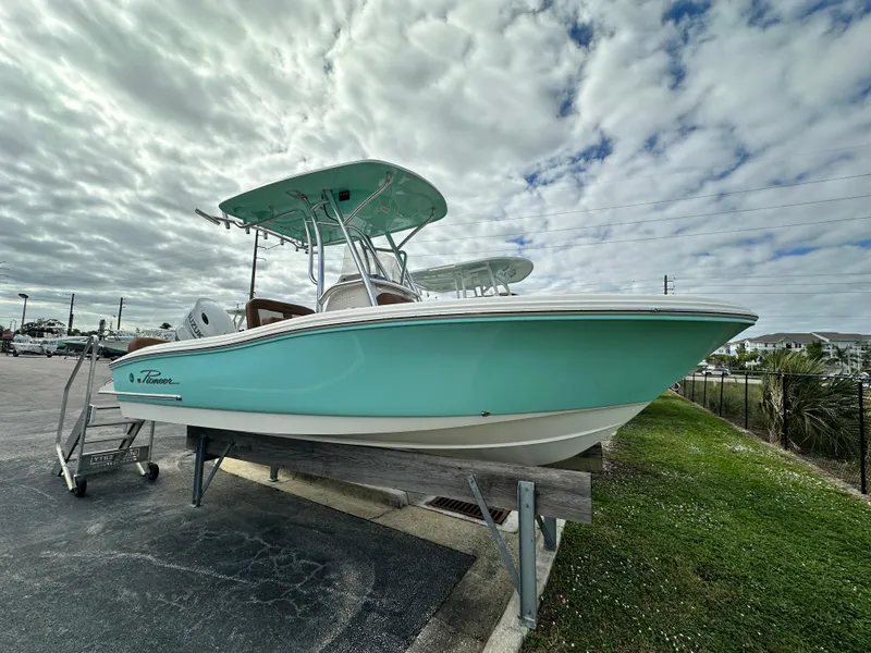 The Image of 2025 Pioneer 202 Sportfish boat on display under cloudy sky. - 1