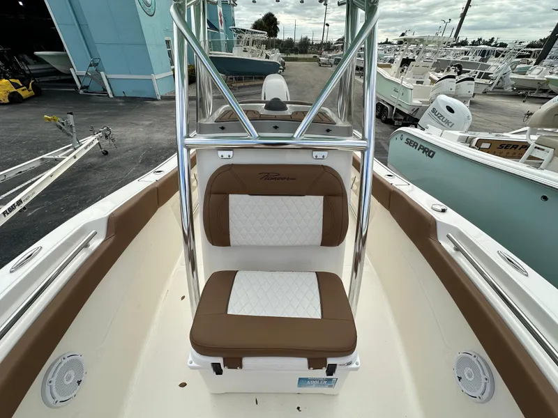 Slide: The Image of 2025 Pioneer 202 Sportfish boat interior with brown and white seating. - 6