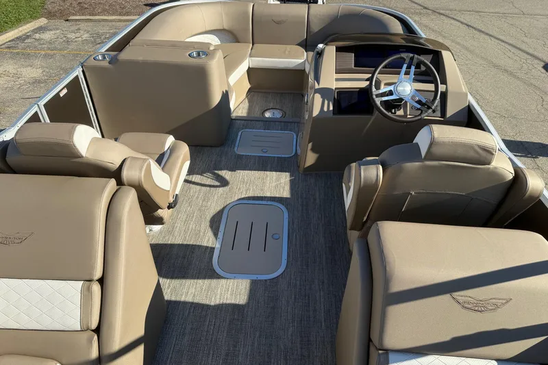Slide: The Image of 2025 Bennington L Bowrider Line interior with luxurious seating and modern steering console. - 10