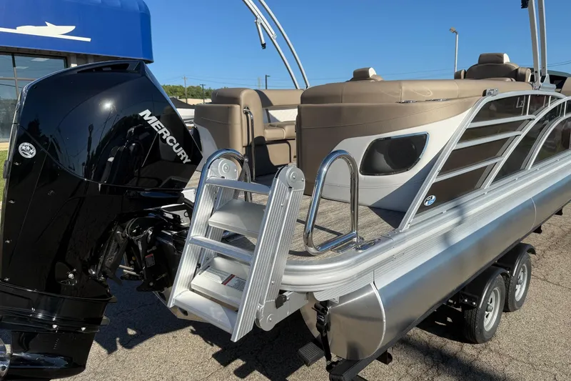 Slide: The Image of 2025 Bennington L Bowrider Line pontoon boat with Mercury engine and ladder. - 14