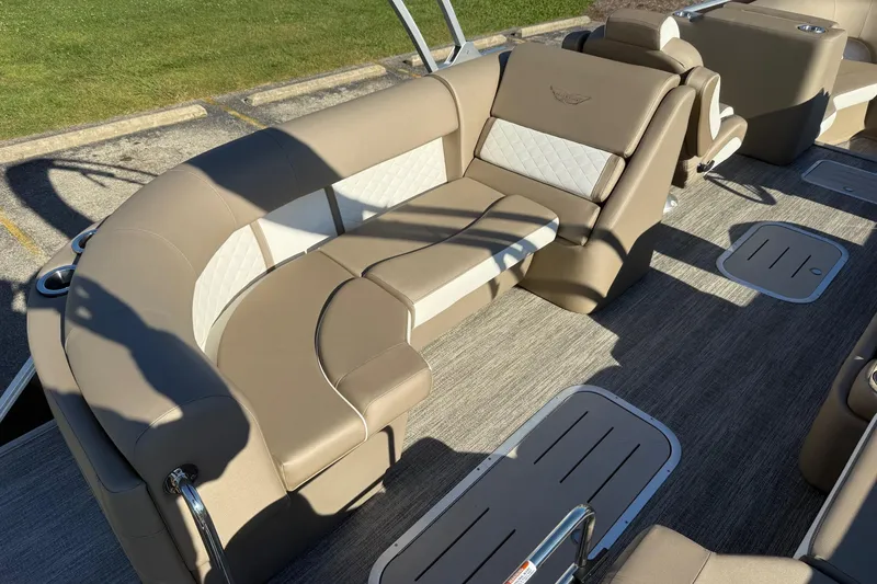 Slide: The Image of 2025 Bennington L Bowrider Line boat interior with luxurious beige seating and modern design. - 7