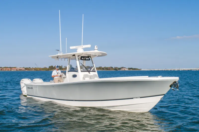 The Image of 2021 Regulator 34 Center Console boat cruising on open water. - 0