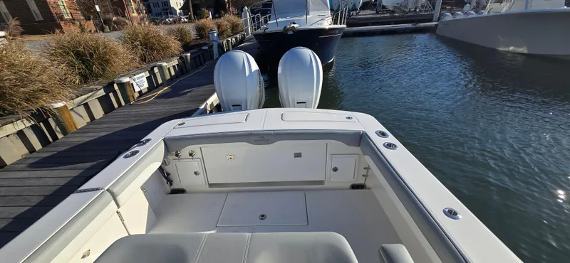 Slide: The Image of 2021 Regulator 34 Center Console boat docked with twin engines. - 17