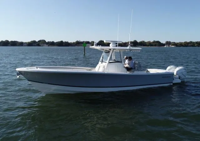 Slide: The Image of 2021 Regulator 34 Center Console boat on calm water. - 19
