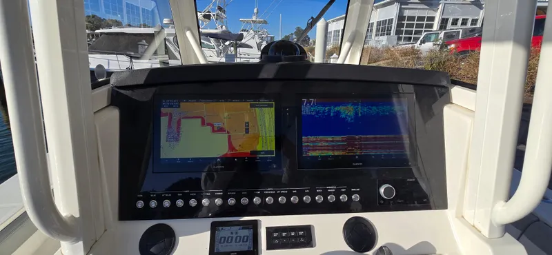 Slide: The Image of 2021 Regulator 34 Center Console dashboard with navigation and sonar displays. - 6