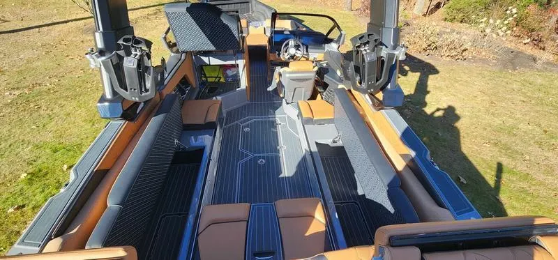 Slide: The Image of 2022 Nautique G25 Paragon boat interior with luxurious seating and advanced features. - 29
