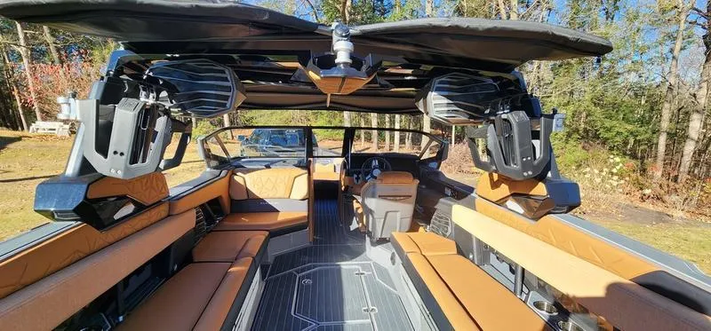 Slide: The Image of Interior of 2022 Nautique G25 Paragon boat with luxurious seating and advanced sound system. - 35