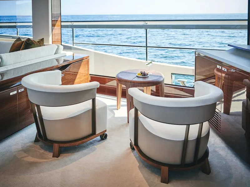 Slide: The Image of Luxurious interior of 2025 Princess X95 yacht with ocean view and elegant seating. - 16