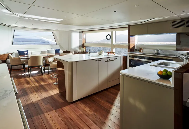 Slide: The Image of Luxurious interior of 2025 Princess X95 yacht with modern kitchen and dining area. - 22