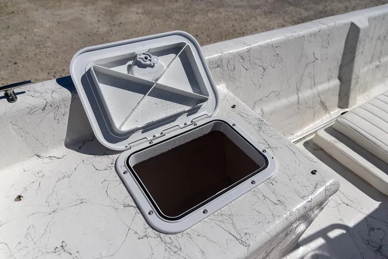 Slide: The Image of Open storage compartment on 2025 Coastal Skiff 184 boat. - 15
