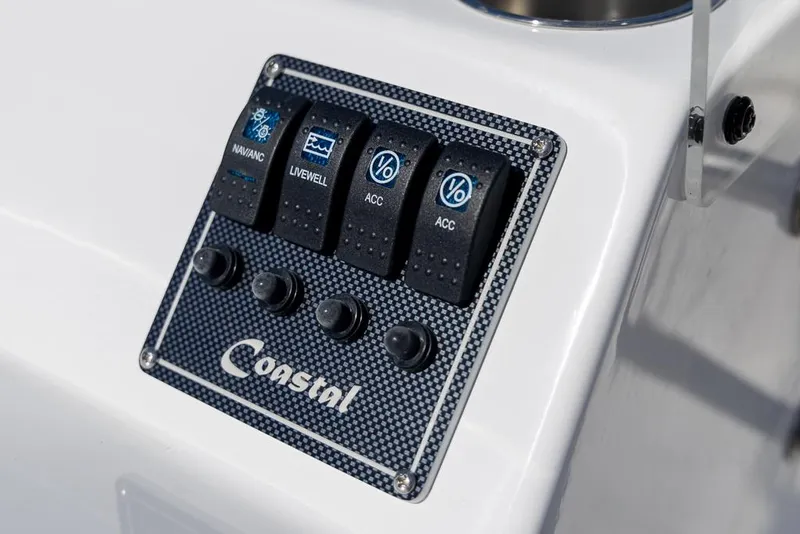 Slide: The Image of Control panel of 2025 Coastal Skiff 184 boat with labeled switches. - 20