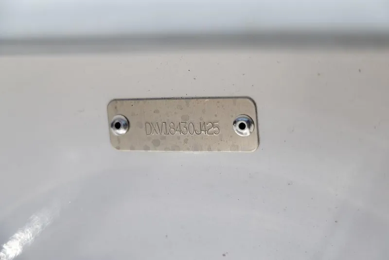 Slide: The Image of Metal identification plate on 2025 Coastal Skiff 184 boat. - 22