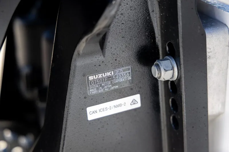 Slide: The Image of Close-up of a Suzuki motor label on a 2025 Coastal Skiff 184. - 23