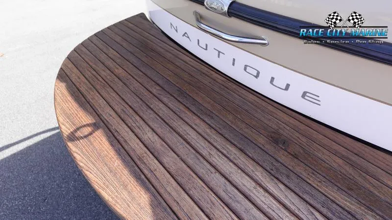 Slide: The Image of 2003 Nautique Air Nautique 216 boat with wooden deck detail. - 10