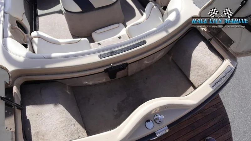 Slide: The Image of 2003 Nautique Air Nautique 216 boat interior with seating and storage area. - 11