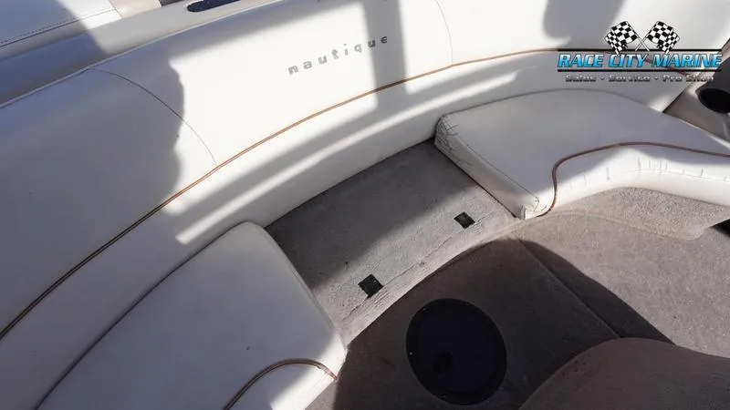 Slide: The Image of 2003 Nautique Air Nautique 216 boat interior with white seating and carpeted floor. - 15