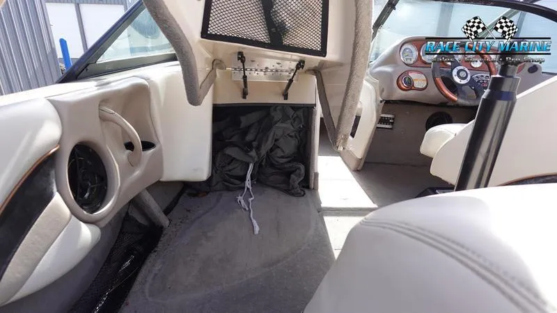 Slide: The Image of 2003 Nautique Air Nautique 216 boat interior with dashboard and seating. - 20