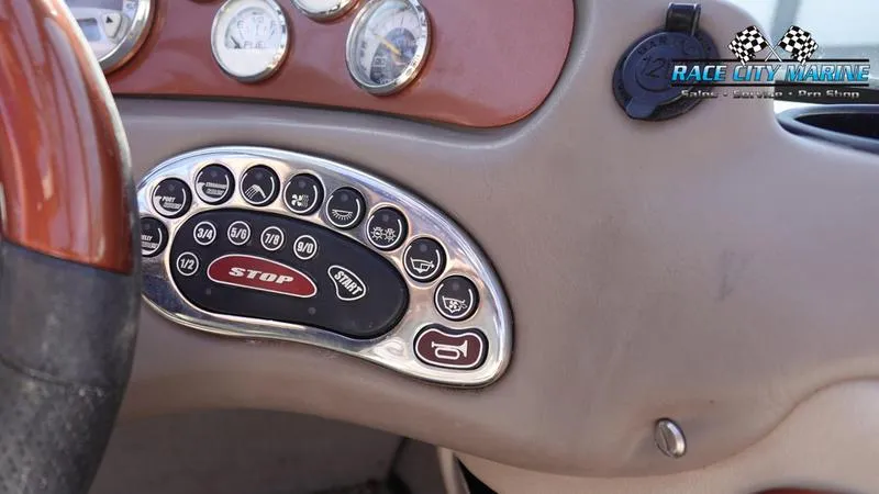 Slide: The Image of Dashboard controls of a 2003 Nautique Air Nautique 216 boat. - 25