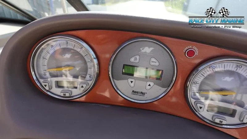 Slide: The Image of Dashboard of 2003 Nautique Air Nautique 216 boat with gauges and controls. - 27