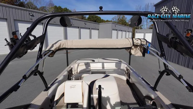 Slide: The Image of 2003 Nautique Air Nautique 216 boat interior with wakeboard tower, parked at Race City Marine. - 35