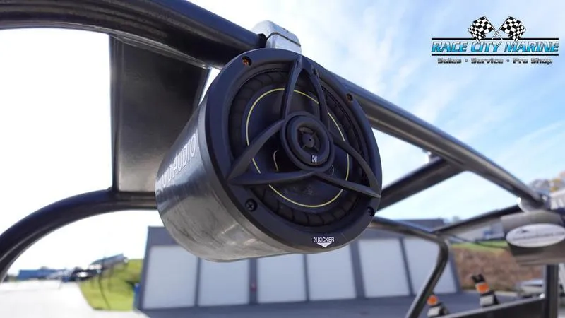 Slide: The Image of Close-up of a 2003 Nautique Air Nautique 216 boat speaker with Race City Marine logo. - 36