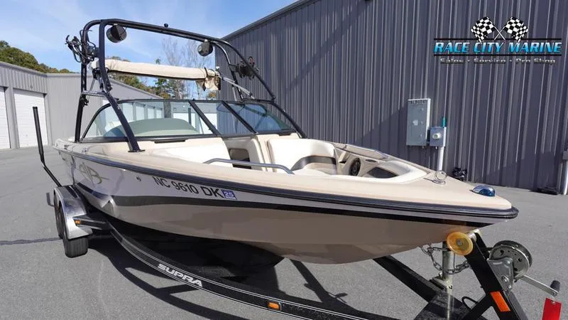 Slide: The Image of 2003 Nautique Air Nautique 216 boat on trailer at Race City Marine dealership. - 5