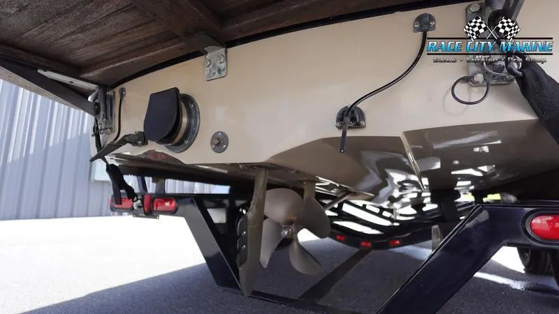 Slide: The Image of 2003 Nautique Air Nautique 216 boat propeller and trailer detail. - 9