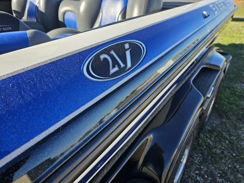 Slide: The Image of 2013 Skeeter 21i boat, blue exterior with logo detail. - 5