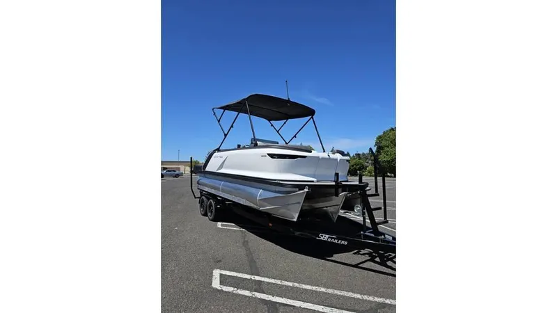 Slide: The Image of 2025 Manitou 20 CRUISE MAX with 150hp Rotax Stealth Motor on trailer. - 4