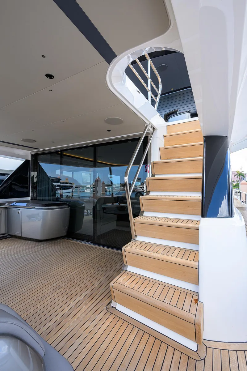 Slide: The Image of Staircase on 2025 Princess Y85 Motor Yacht with sleek wooden deck. - 15