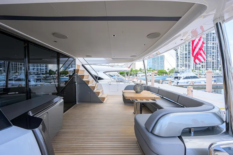 Slide: The Image of Luxurious 2025 Princess Y85 Motor Yacht deck with elegant seating and modern design. - 18