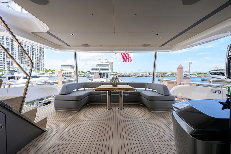 Slide: The Image of Luxurious 2025 Princess Y85 Motor Yacht interior with elegant seating and marina view. - 19