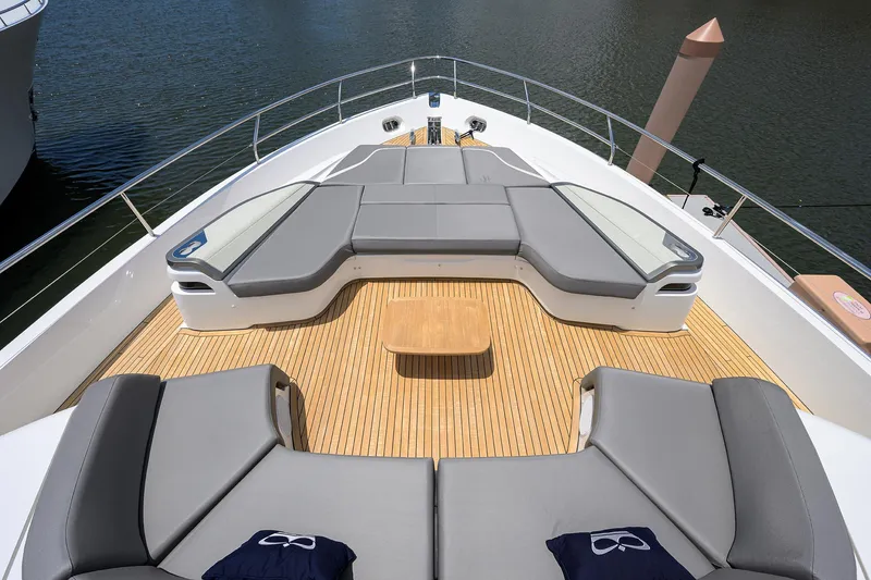 Slide: The Image of Luxurious 2025 Princess Y85 Motor Yacht deck with elegant seating and wooden flooring. - 22