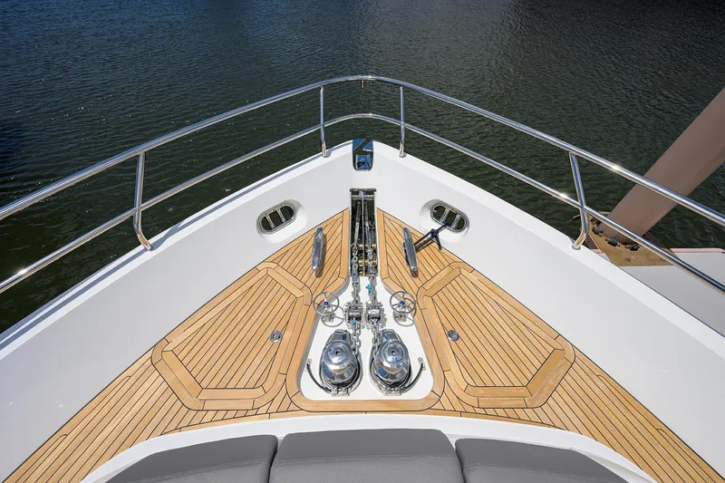 Slide: The Image of Bow of 2025 Princess Y85 Motor Yacht with teak decking and stainless steel fittings. - 25
