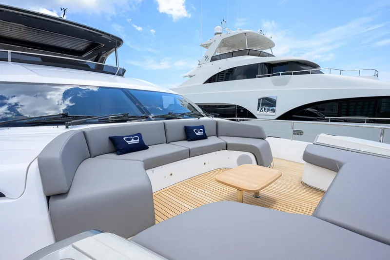 Slide: The Image of Luxurious 2025 Princess Y85 Motor Yacht with elegant deck seating and modern design. - 27